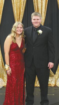 Phoebe Stovel escorted by Johnny Osowski