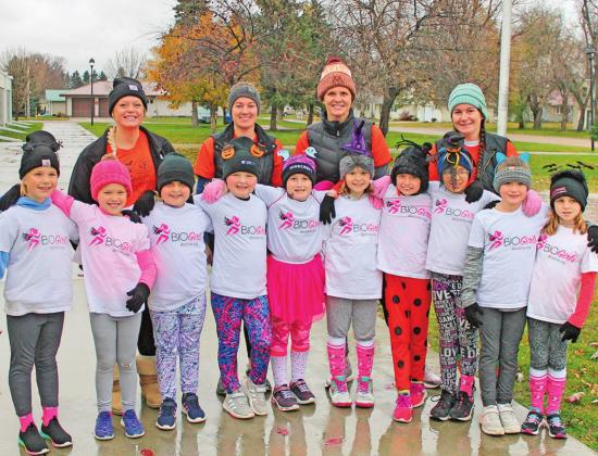 The BIO girls pose for a picture before starting their 5K run. Pictured left to right are: front row Shea Aasand, Evie Hillier, Molly Grundstrom, Marissa Grundstrom, Paige Tunks, Lana Kalka, Ruthie Rarick, Hailey Ladouceur, Brynlee Christenson, and Natalie Helm. Back row: Katie Dahl, Stephanie Woinarowicz, Christie McFarland, and Maggie Vold. Photo submitted by Jamie Rarick