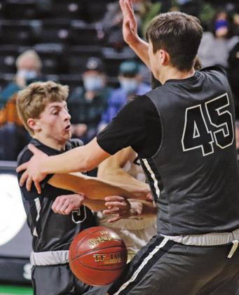 Sam Johnson and Gage Pollestad double team a North Border Eagle to keep him from scoring in the Region II Tournament game Monday afternoon. VNV photo by Lesa Van Camp