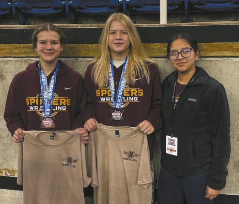 (L-R) Violet Hoyles (Drayton) placed third in the 124 weight class, Alyssa Hoyles (Drayton) placed second in the 130 weight class and Dylienna Solis (Grafton) did not place in her weight class at the Rumble on the Red Tournament in Fargo. Photo courtesy of Spoilers Wrestling