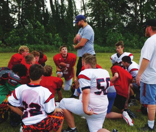 First year head coach Foster visits with the team after practice on Monday morning. VNV photo by Lyle Van Camp