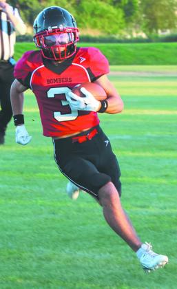 Trenten Keena breaks out for a long gain against White Shield. Photo by Lyle Van Camp