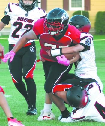 Daniel DeSouza grinds out a few yards in the homecoming game on Friday evening. Photo by Lyle Van Camp