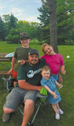 Brett Christenson and his three children. Submitted by Kallie Christenson