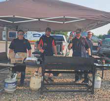 Jason Morris, Scott Halvorson, Jeremy Ganssle, and Travis Uggerud at the Firemens’ Burger Feed. Photo by Christine Jensen.