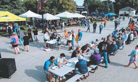 Locals and visitors lined up to eat and support the Drayton Volunteer Fire Department at Riverfest. Photo by Duane H.H. Lyon