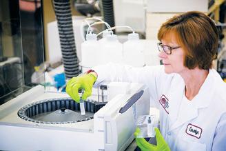 EERC senior analytical chemist Carolyn Nyberg conducts chemical analysis of critical materials.