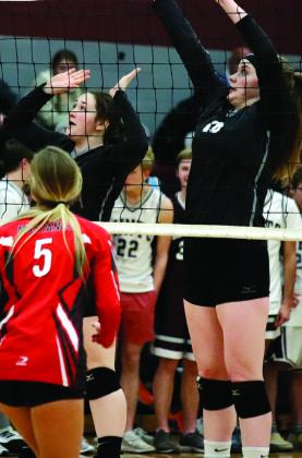 Madison Hermanson and Maria Myrdal go up for the block against the Mustangs in the Minto gym Monday night. VNV Photo by Lesa Van Camp