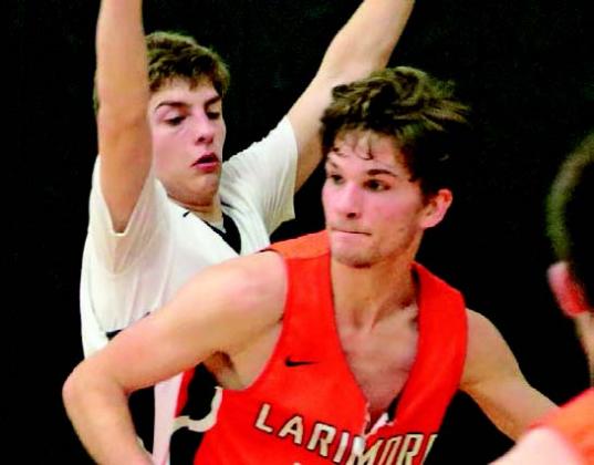 Sam Johnson guards against one of the Larimore players in the Drayton Gym last Tuesday. Photo submitted by Kerri Stegman, Drayton Public School