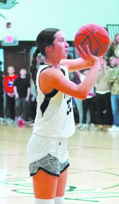 DVE’s Jaelyn Johnson is looking to pass during the game against Midway- Minto. Photo by Larry Stokke