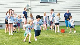 Children enjoyed outside games throughout VBS despite the heat. Photo by Hilary Nowatzki.