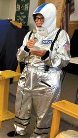 Glenda Erickson AKA astronaut ‘Sandy Dunes’ visiting with the children at VBS. Photo by Cindy Johnson.