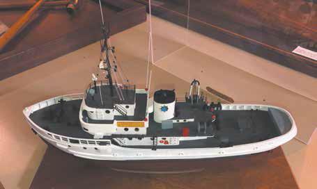 A wood model replica of the tugboat Clint served on. Photo by John Shafer in 2019 at the Mare Island Naval Museum.