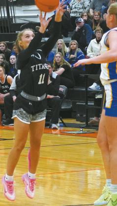 Jacey Nelson goes for the shot against Benson County defense. Photo by Larry Stokke