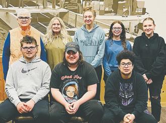 YOUNG EMPLOYEES STEP UP TO THE PLATE, literally, while Hastings Landing manager recovers