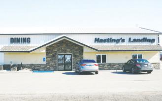 YOUNG EMPLOYEES STEP UP TO THE PLATE, literally, while Hastings Landing manager recovers
