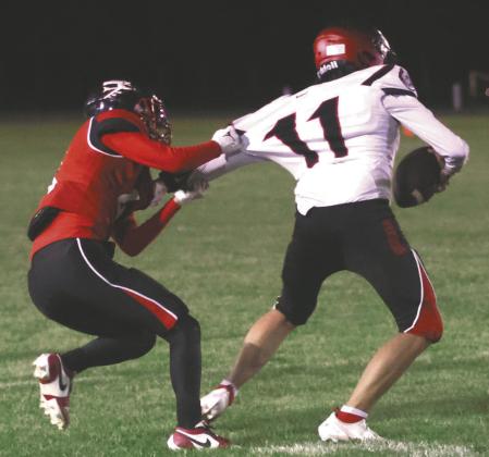 Trypp Castillo stops White Shield's Daceton Demarce late in the game. Photo by Lyle Van Camp