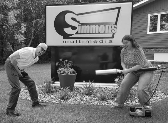 Bazooka Brandi shoots Bob with T-Shirt cannon. That’s got to hurt.