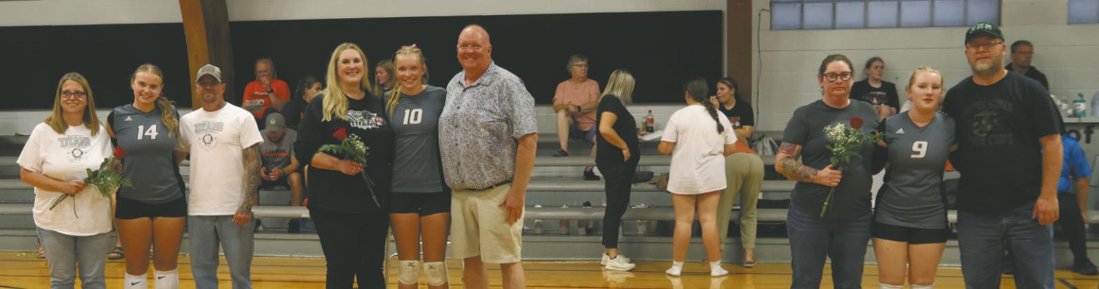 Aleah Pokrzywinski, Easton Larson and Emily Williams with their parents on Parent’s night. Photo by Kerri Stegman