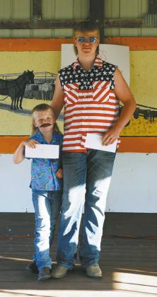 Mickane (left) and Chaz (right) Halverson took first and second in the mullet contest. Photo by Larry Stokke