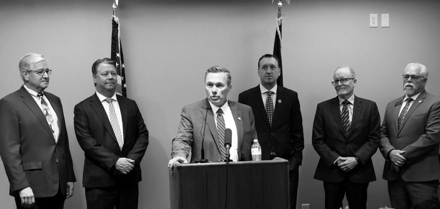 Senate Majority Leader David Hogue, R-Minot, announces a new interim Artificial Intelligence and Data Center Committee at the Capitol on June 25, 2026. Also pictured are, from left, Rep. Todd Porter, R-Mandan, Rep. Mike Nathe, R-Bismarck, Rep. Jonathan Warrey, R-Casselton, former North Dakota University System Chancellor Mark Haggerott, and Sen. Mike Wobbema, R-Valley City. (Photo by Michael Achterling/North Dakota Monitor)