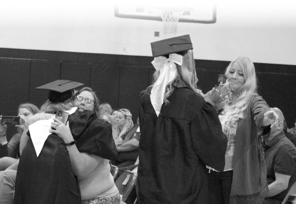 Siobhan Kissee and Emily Jerome thank their moms with hugs and flowers.