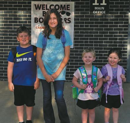Thomas - 2nd grade, Daidralynn - 6th, J-Lee - 1st year pre-k and Elizabeth - 1st year pre-k. It was also the twins 4th birthday on their very first day of attending school. Photo submitted by Stormy Manley
