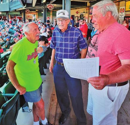 Pictured left to right are: Ray Long, Bill Long, and Mark Tungseth visit at a Red Hawks game last week. Photo submitted by Clint Van Camp