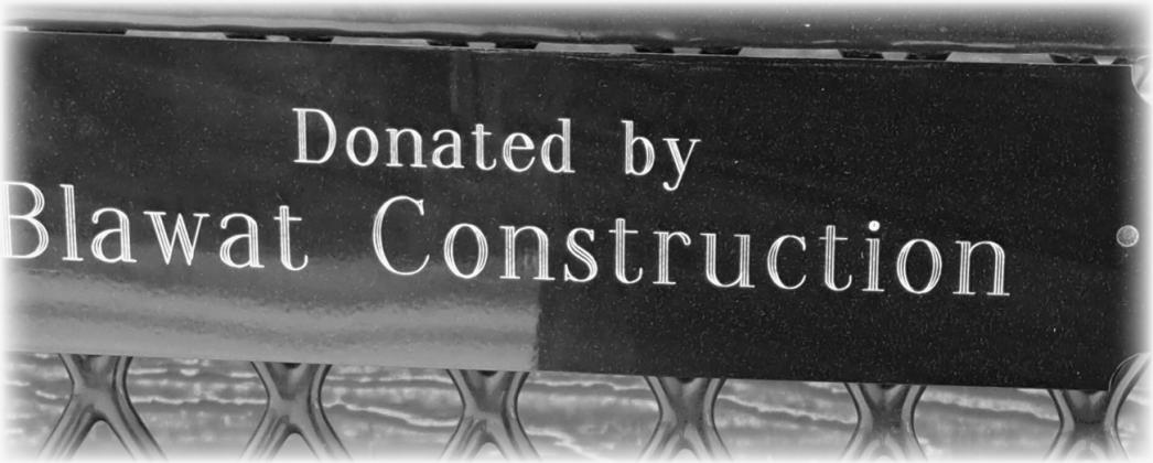 Donated benches are marked with a plaque. Photo by Christine Jensen