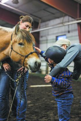 Bison Strides partners veterans and individuals with disabilities and horses to build strength, resiliency and independence. Photo courtesy NDSU