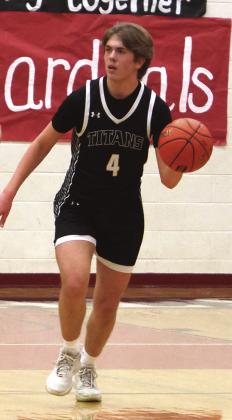 Charlie Kittelson brings the ball up the court in action against North Star.