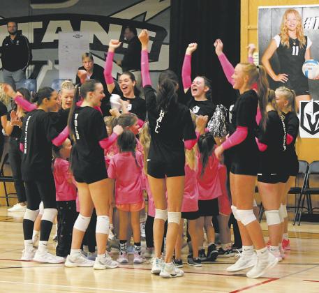 DVE Tiny Titans joined the varsity squad in a cheer before Friday's volleyball game. Photo by Jamie Rarick.