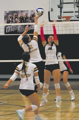 Going for the block, DVE's Ingrid Myrdal jumps in front of Grafton's Julia Heidt. Photo by Jamie Rarick.