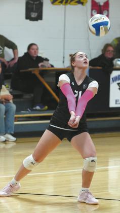 Junior Scarlett Dregerkeeps the ball in play in the match against North Border. Photo by Larry Stokke.