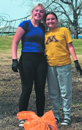 Students work together to pick up trash in their community. Photo by Christine Jensen