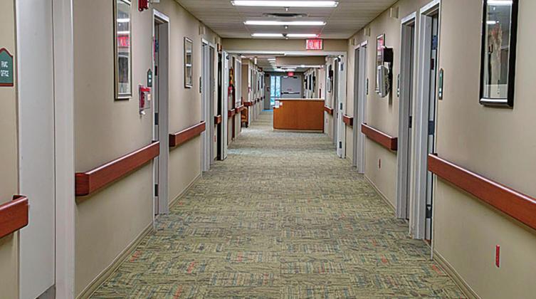 Pictured above an internet picture of an empty hallway that could represent any long term facility anywhere in the country during this time of COVID-19. With visitations and connections to other residents being cut off or limited the hallways become empty.