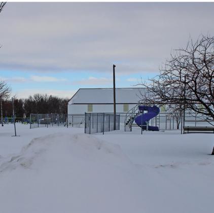 Schumacher park lies dormant many layers of snow just waiting for summer to arrive along with all the summer activities. VNV Photo by Lesa Van Camp
