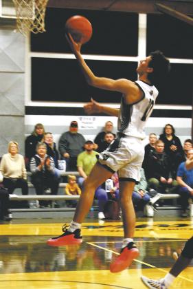 DVE senior Brady Reilly goes up for a layup in Edinburg Feb. 8. Photo by Jamie Rarick