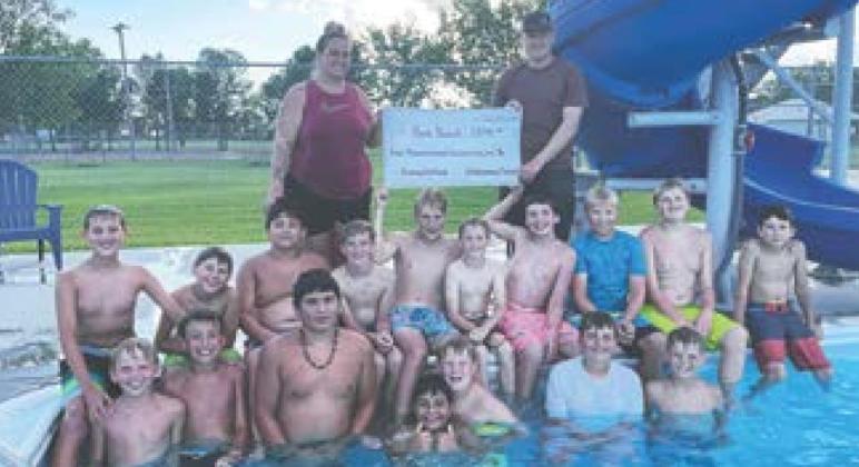 12U boys baseball team at their end of year party at the Drayton Swimming Pool. Pictured with the boys is Daniella Pokrzywinski, Drayton Swimming Pool manager and Chase Boen, boys 12U coach and Dayton Park Board member.