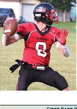 Gavin Ryan looks for an open receiver. Photo by Lyle Van Camp.