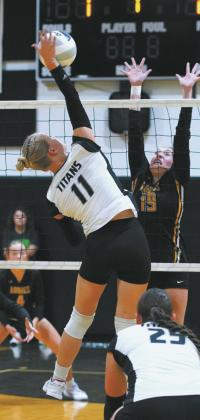 DPS senior, Alyssa Hoyles slams the ball over the net in the match against Park River. Photo by Larry Stokke.