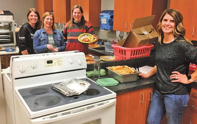 Pictured above Left to right: Track Moms serving supper: Natalie Feltman, Stacey Reilly, Naomi Myrdal and Sara Gullickson. Photo submitted