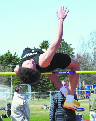 Mason Pollestad places first in the high jump. Photo by Larry Stokke.