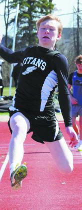 Joe Langerud launches in the long jump. Photo by Larry Stokke.