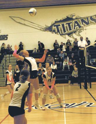 Winding up for the hit, DVE sophomore Peyton Larson jumps for the shot. Photo by Jamie Rarick