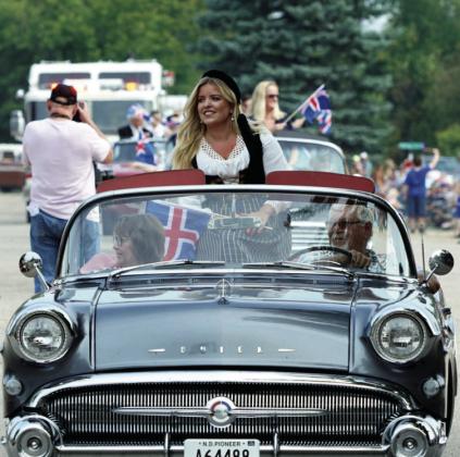 Her Excellency Áslaug Arna Sigurbjörnsdóttir, Iceland’s Minister of Higher Education, Science, and Innovation, riding in the parade on Saturday before her keynote speech. Photo by Larry Stokke
