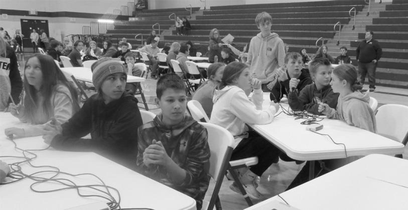 North Border Walhalla and Park River Area students thinking hard during lightning round practice question.