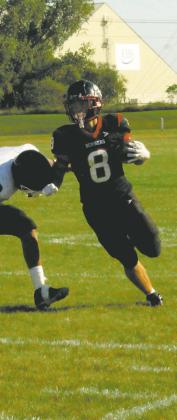Carter Johnson gets around a Braves defender. Photo by Jamie Rarick.