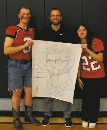Junior class representatives Maddox Oihus and Allisson Chavez won Friday's homecoming drawing contest with their representation of DPS superintendent Jason Keating. Photo by Jamie Rarick.