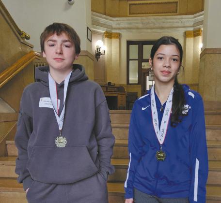 Drayton Students Rylan Nord and Angelina Carmo participate in the Pembina County Spelling Bee. Photo by Jamie Rarick